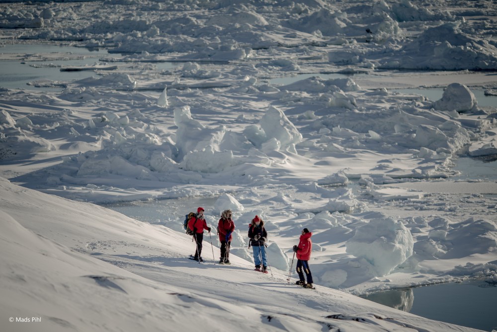 Snowshoers on the edge of the Ilulissat ice fjord in Greenland